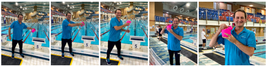 In various poses with a toy watering can when teaching swimmers.